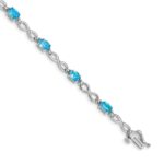 10k White Gold Blue Topaz and Diamond Infinity Bracelet